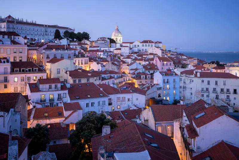 Terracotta rooftops of Lisbon at blue hour
