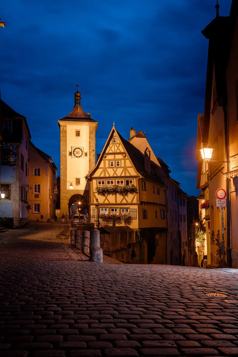 Half-timbered house and gate tower (Plönlein) in Rothenburg ob der Tauber at night